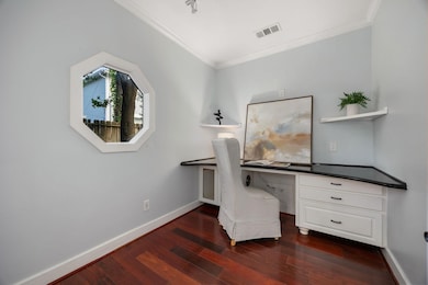 A private study through double glass doors adds a