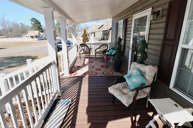 Wooden terrace featuring a porch