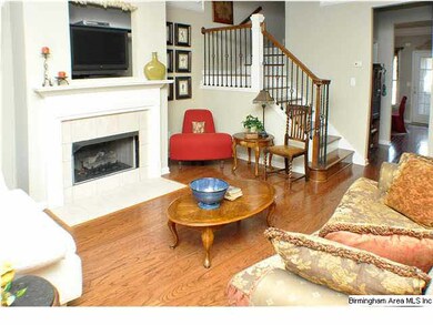 Notice the custom iron railing leading up the stai