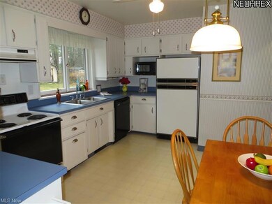 White Eat-In Kitchen w/updated hardware. Plenty of