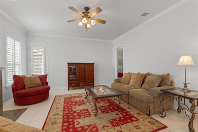 Living area with light tile patterned flooring, a
