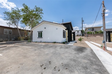 View of side of property featuring stucco siding,