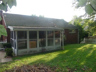 Exterior Back. Back side of home has sun room and 