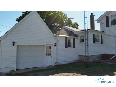 Exterior Back. Attached garage.