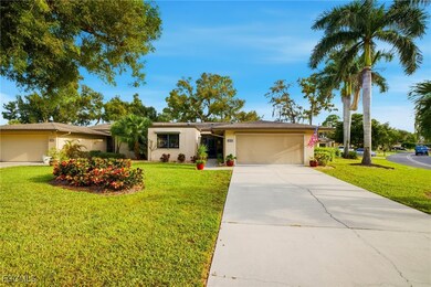 Single story home featuring an attached garage, stucco siding, concrete driveway, and a front lawn
