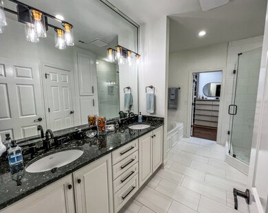 Master bath includes granite countertops, new LED lighting, frameless glass shower, Jacuzzi tub and more!
