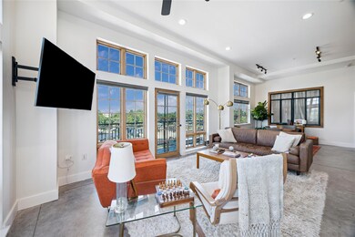 Living area with concrete flooring, recessed ligh