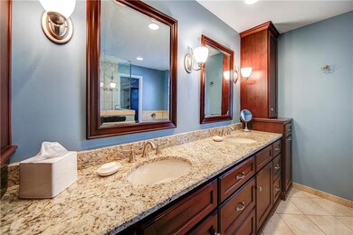 The Master Bath boasts custom cabinets, double van