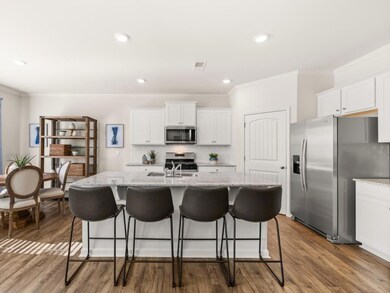 hayden kitchen with a large island used for bar se