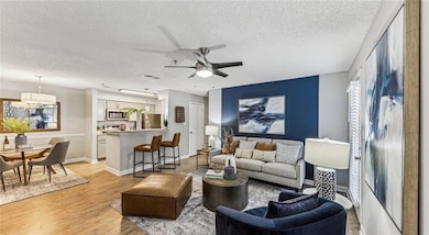 Living room featuring a textured ceiling, ceiling 