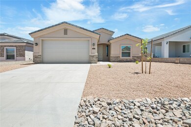 View of front of house featuring stone siding, dri