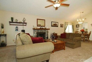 VIEW OF THE LIVING ROOM AND FORMAL DINING ROOM