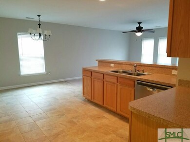 Kitchen with breakfast dining area and open bar to