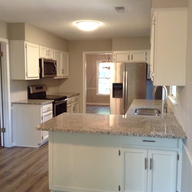 Beautiful new granite, appliances and floors.