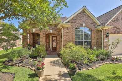 The yard is perfectly landscaped with mature trees, freshly mulched flower beds and lush landscaping!