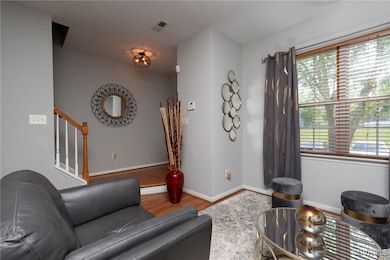 Living room featuring wood finished floors, plenty