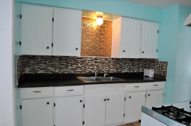 Kitchen with tile backsplash