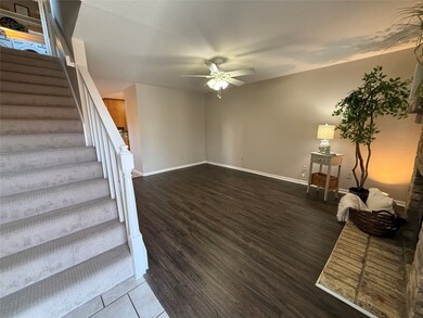 Stairs to second floor with new carpet.