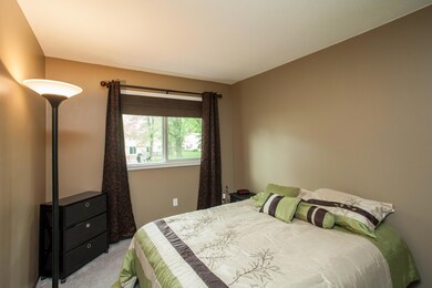 Bedroom 1 of 3 is located on the main floor, carpet, neutral paint colors, new south facing windows in 2010, spacious closet