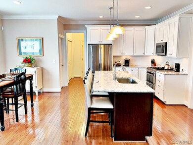 Large Eat-in Kitchen boasts Gleaming Hardwood Floo