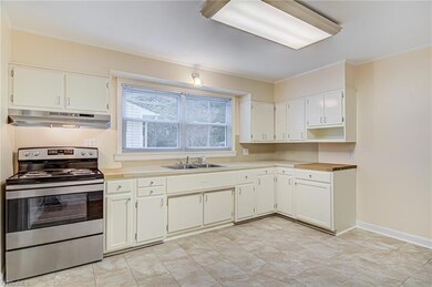 Eat-in kitchen with lots of cabinetry and counter space!