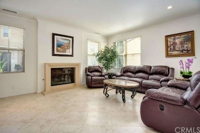 Greatroom with cozy fireplace, crown molding, 16