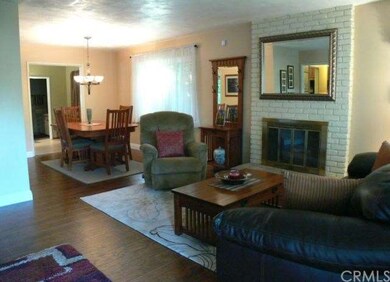 View of living room and dining area as you enter t