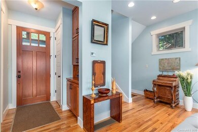 Entrance foyer with custom oak cabinetry and coat 
