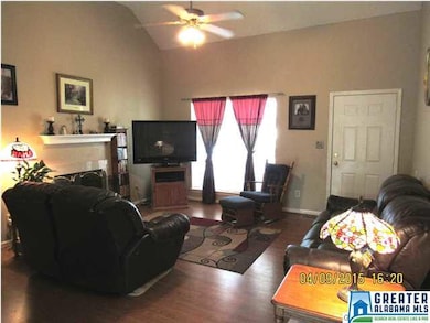 An oversized window in the livingroom fills the sp