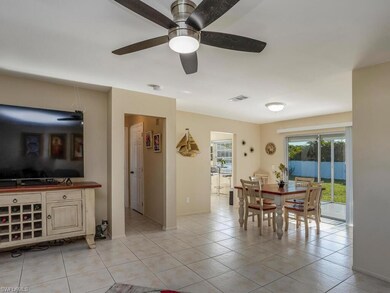 Dining area with tile flooring and sliders doors l