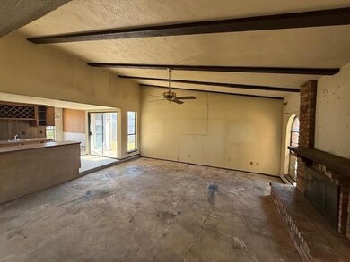 Unfurnished living room featuring concrete floors,