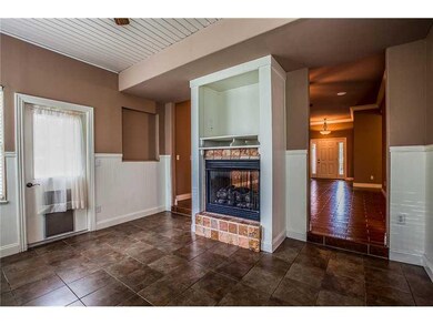 Den/Family/Great Room. Den opposite Great Room with double sided fireplace.