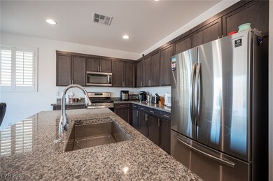 Kitchen featuring appliances with stainless steel