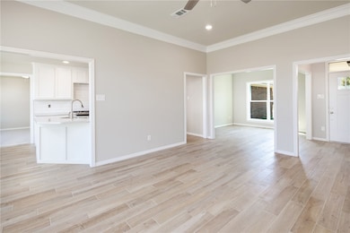 Living Area open to Bonus Room and Kitchen