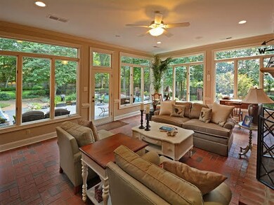Expansive windows with transoms open to gorgeous p