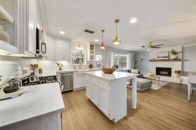 The kitchen offers NEW quartz counters, tile backs
