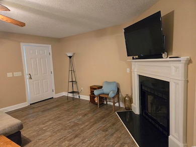 Living room with dark hardwood / wood-style floori