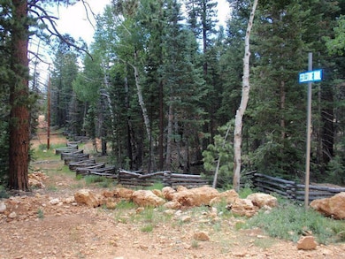 Adjoining lot has log fence in place