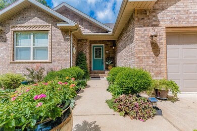 Brick front and covered front porch...SO pretty! Just look at the landscaping!