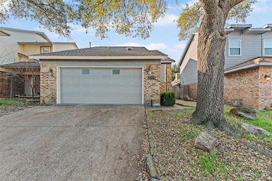 View of side of home featuring a garage