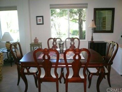 View dining room with designer carpet.