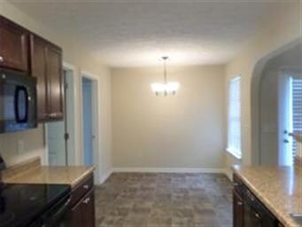 Kitchen with Eat-In Area Beyond