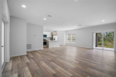 Unfurnished living room featuring recessed lighting and light wood-style flooring