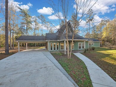 Front view of home showing large 2 car attached ca
