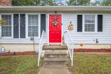 View of exterior entry with a yard