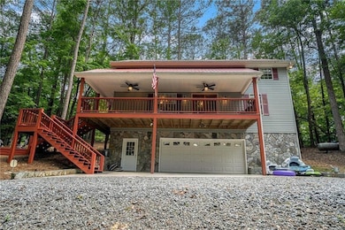 View of front of house featuring ceiling fan and a