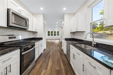 Beautiful kitchen with granite counters, stainless