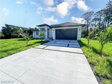 Ranch-style house featuring concrete driveway, a g
