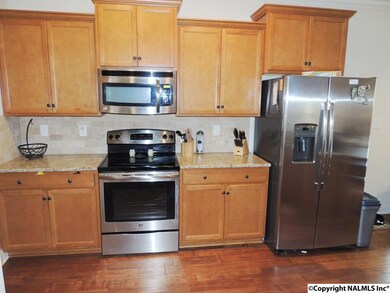 Wood floors thruout the downstairs except in Master BR