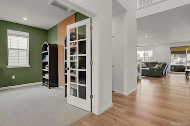 Office at front entry with french doors